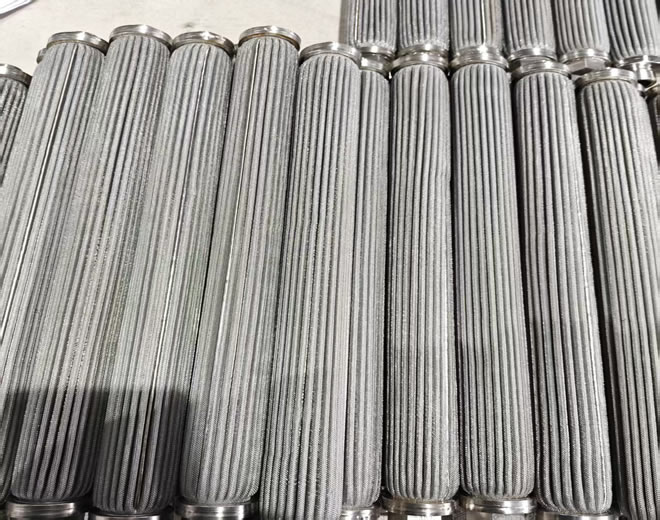 Stainless steel sintered pleated filter cartridge used in recycled plastics.